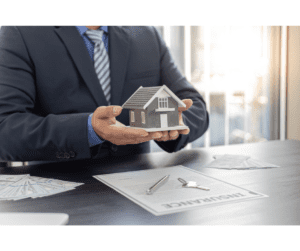 shop flood insurance - man holding small house